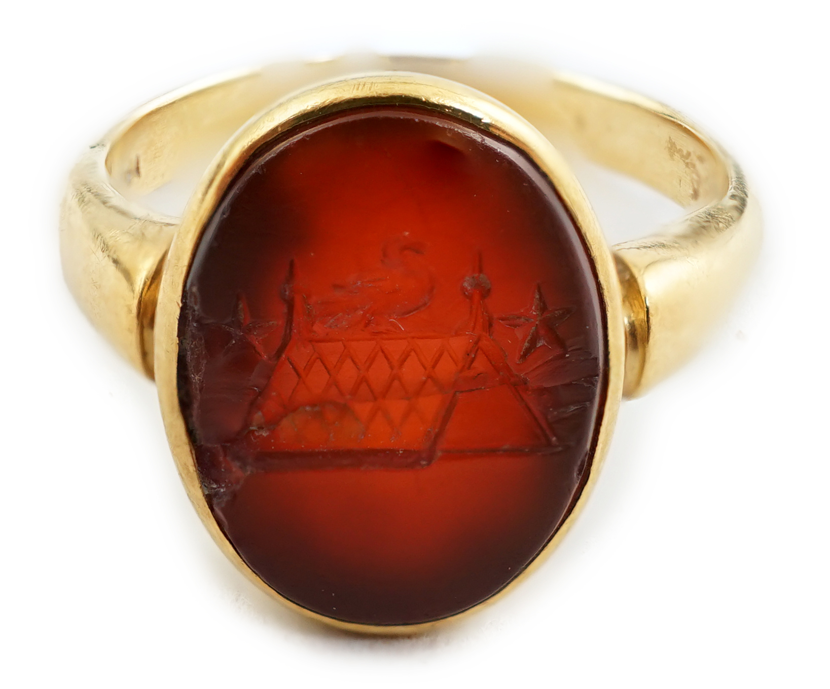 A Victorian 18ct gold and intaglio carnelian set child's signet ring